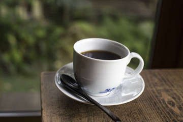 Espresso Coffee cup on wood table in cafe