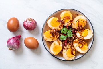 Fototapeta na wymiar Fried Boiled Egg with Tamarind Sauce