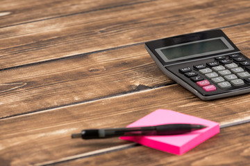 calculator with post it and pen