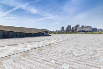 Panoramic skyline and modern business office buildings with empty road,empty concrete square floor