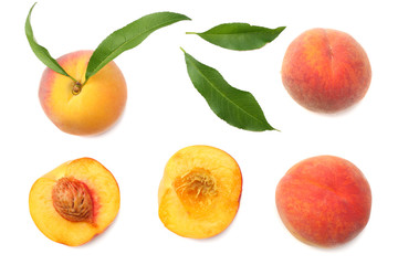 peach fruit with green leaf and slices isolated on white background. top view