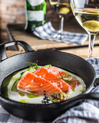 Marinated salmon with cream cucumber and dill.