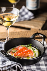 Marinated salmon with cream cucumber and dill.