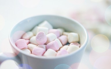 Marshmallow in white cup soft focus closeup background. Concept of Christmas Holiday