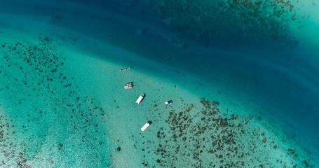 boats in a lagoon in French Polynesia, in aerial view