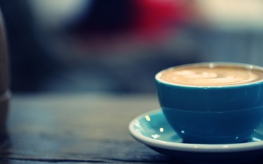 Latte coffee closeup vintage style blur background