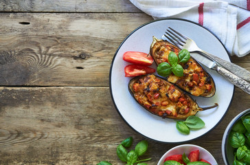 Stuffed eggplants with tomatoes and cheese on a plate
