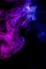 Colored smoke on black background