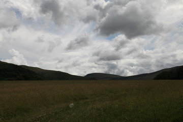 Fototapeta na wymiar Clouds and Field in Brecon Beacons