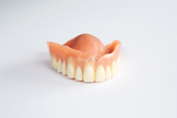 closeup of dental prosthesis on white background