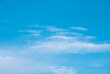 Blue sky with fluffy clouds, background image