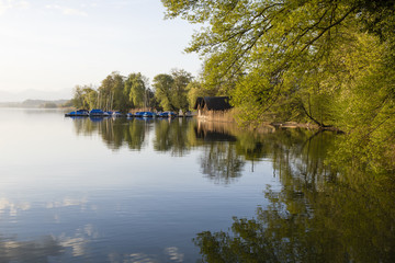 Fototapeta na wymiar Beautiful morning mood with boats on Lake Sempach in Switzerland.