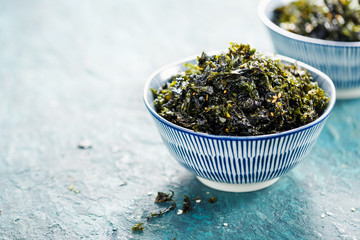 Healthy Japanese bowl of seaweed with sesame and sea salt. Food background with copy space. © valya82