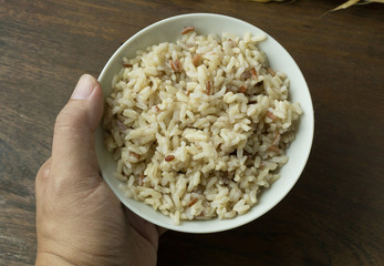 A Cooked  Jasmine Rice , Brown Rice in bowl  on wood table.