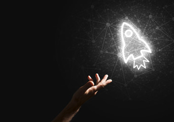 Man palm presenting Rocket web icon as technology concept