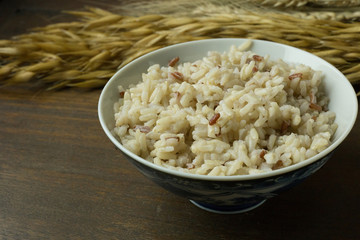 A Cooked  Jasmine Rice , Brown Rice in bowl  on wood table.