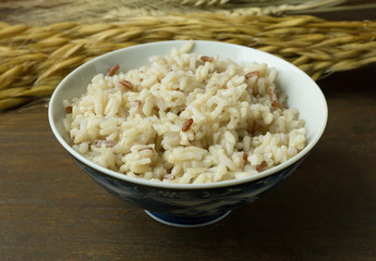 A Cooked  Jasmine Rice , Brown Rice in bowl  on wood table.