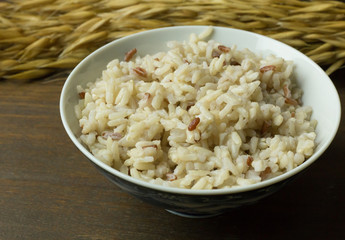 A Cooked  Jasmine Rice , Brown Rice in bowl  on wood table.