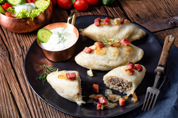 Rustic Cepelinai, a specialty Lithuanian and Polish cuisine.