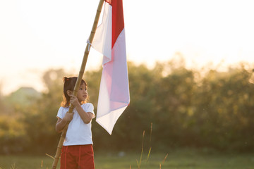 kids raising indonesian flag