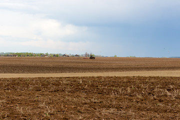 Fototapeta na wymiar spring plowed field