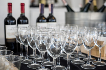 Many empty glasses for wine on the buffet table