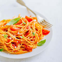 Pasta dish with tomato sauce on white plate