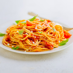 Pasta dish with tomato sauce on white plate