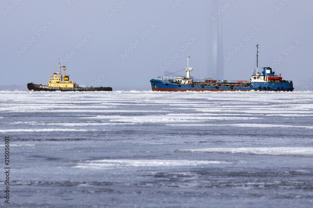 Wall mural tug pulls through the ice container ship