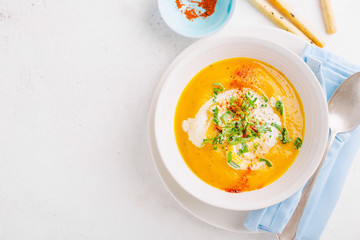 Pumpkin creamy soup in bowl