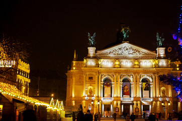 Fototapeta na wymiar Winter beautiful Christmas markets. Night lights. Opera Lviv