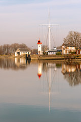 Fototapeta na wymiar Lighthouse in old port of Honfleur in Normandy region of France