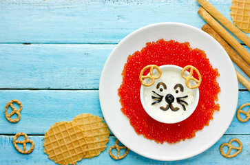 Fun and creative snack idea for kids - lion shaped sour cream red caviar dip bowl with crackers