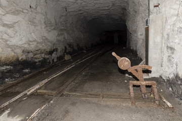 Railway tracks with a crossover in a tunnel of an abandoned lime mine in Switzerland