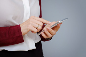 Close up of women's hands holding cell telephone with blank copy space