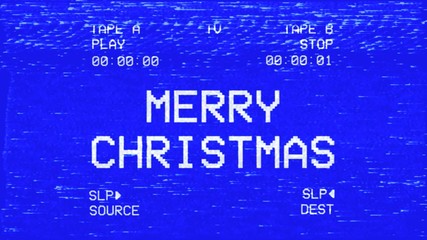 An old damaged VHS tape tracking a bad signal coming from a double deck, with the text Merry Christmas.
