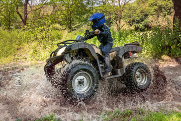 Obraz premium A trip on the ATV on the red road.