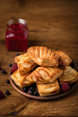Fresh tasty pastries with raspberry jam.