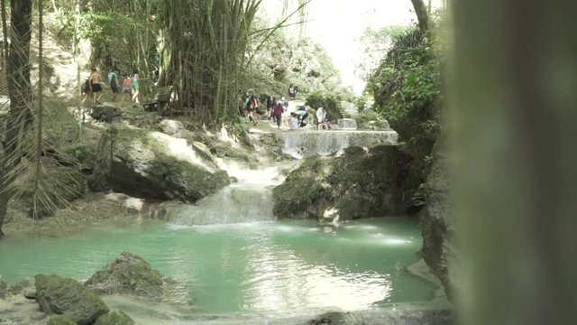 Slider reveal of waterfall Tumalog falls.