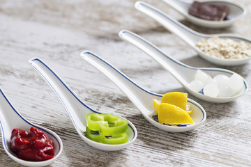 Porcelain spoons with ingredients