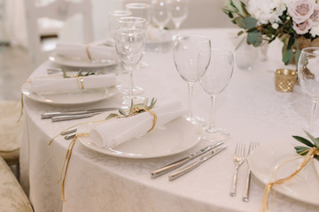 Dining table with beautiful white ware and napkins for a lunch.