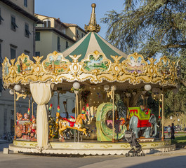 Antique children's carousel in the historic center of Lucca, Tuscany, Italy
