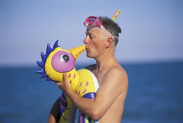 Man with funny swimming belt MR