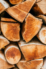 Fototapeta premium Stacked logs for firetexture, natural wooden background of firewood.
