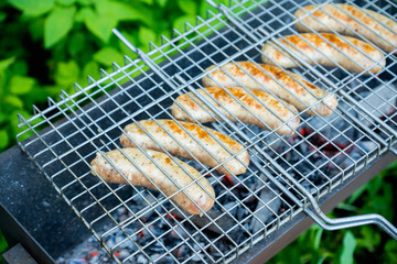 Grilled sausages in the backyard. Selective focus.