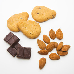 Cookies, chocolate and almond on white background