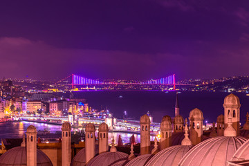 ISTANBUL, TURKEY - JUNE 4, 2017: Night view of galata tower, bosphorus,karakoy bridge and 15 June Martyrs and shore of Beyoglu district from the courtyard of Suleymaniye Istanbul, Turkey.