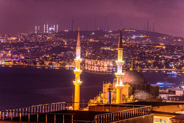 ISTANBUL, TURKEY - JUNE 4, 2017:Mahya of ”Muslims are brother” is written and hung between minarets of Suleymaniye Mosque. Mahya is to write with light especially during ramadan month for muslims