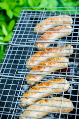 Grilled sausages in the backyard. Selective focus.