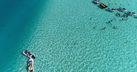 snorkeling in a dream lagoon in French Polynesia, in an aerial view